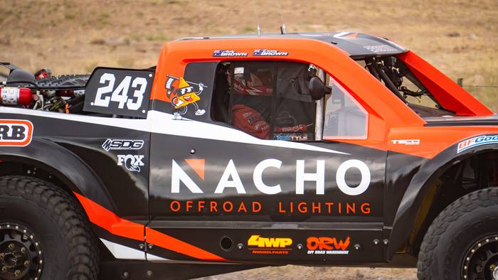 Unlimited Truck SPEC race vehicle number 243 at speed, Danny Brown